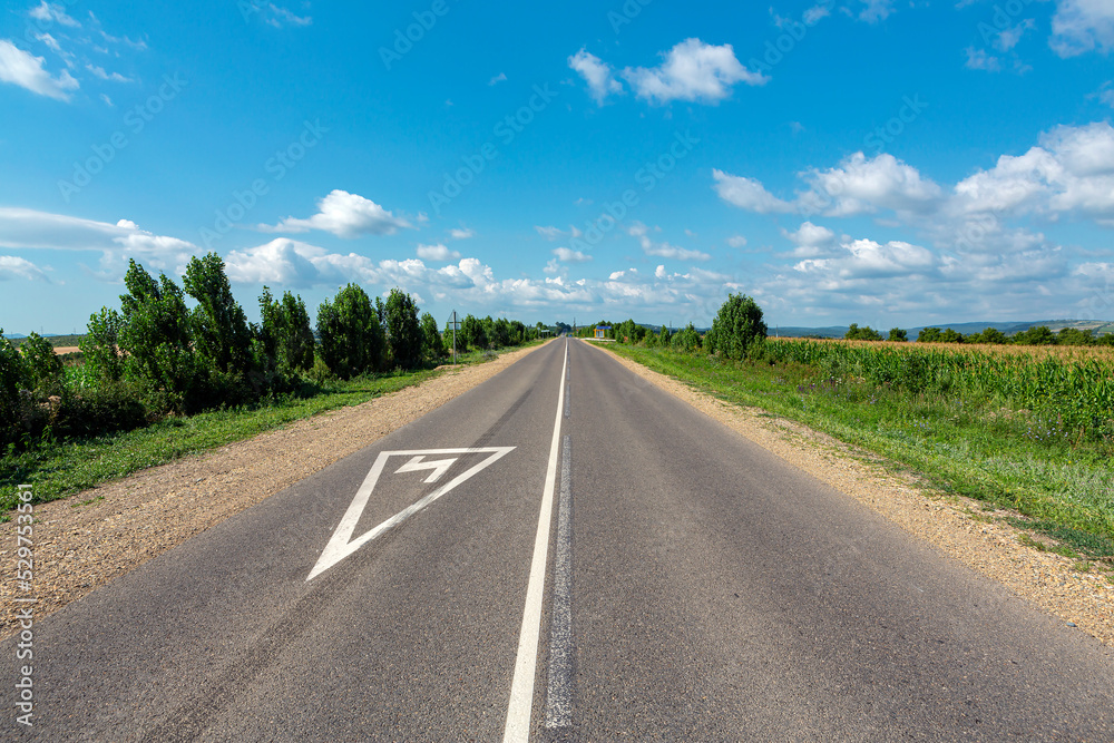 A country road stretching into the sky.