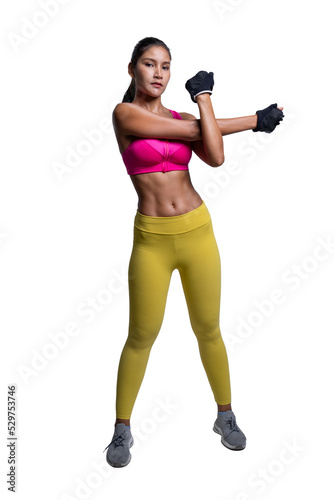Full body length shot of smiling young sporty Asian woman fitness model in pink sportswear doing arms stretching. isolated on white background. Fitness and healthy lifestyle concept.