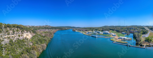 Austin, Texas- Aerial view of Colorado river with large buildings on the right side