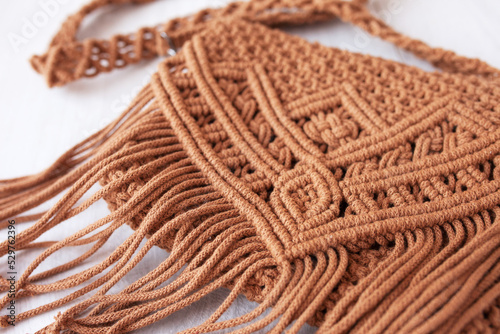 Handmade macrame cotton   ross-body bag. Eco bag for women from cotton rope. Scandinavian style bag.  Brown color  sustainable fashion accessories. Details. Close up image