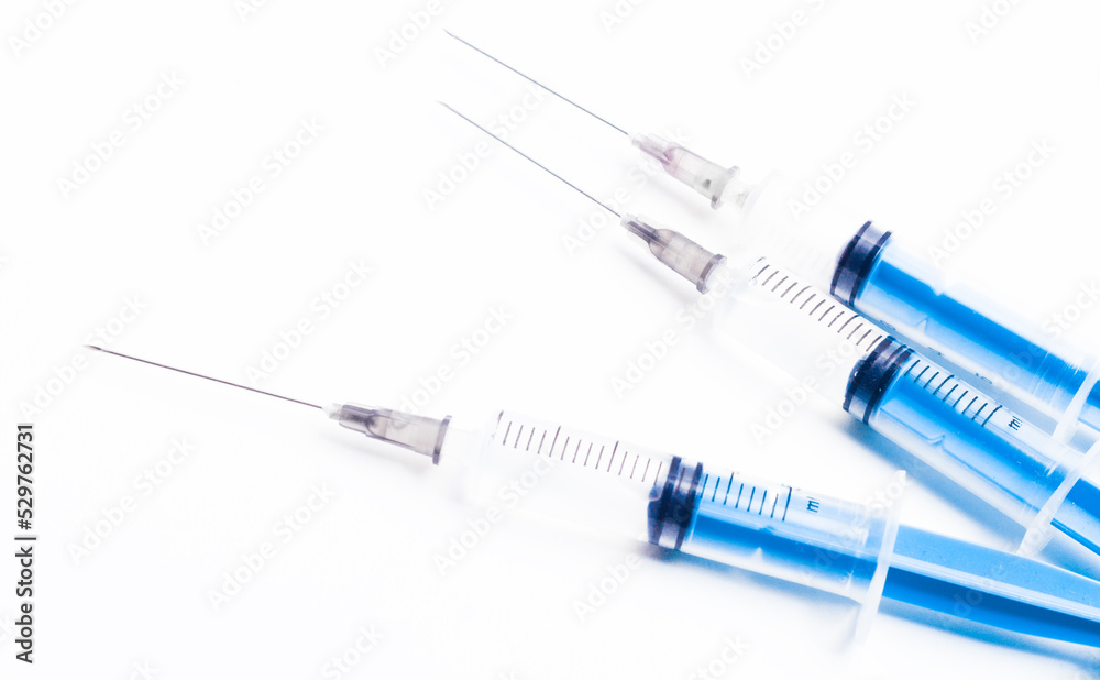 Medical syringe on a white background. A syringe for injection. The concept of health and beauty Medical syringe on a white background. A syringe for injection. The concept of health and beauty