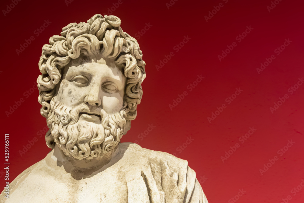 Marble statue of Asclepius, the god of medicine. Roman statue from Perge, ancient city in Antalya region. II century AD. Copy space, close up. History and art concept Marble statue of Asclepius, the god of medicine. Roman statue from Perge, ancient city in Antalya region. II century AD. Copy space, close up. History and art concept