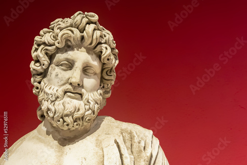 Marble statue of Asclepius, the god of medicine. Roman statue from Perge, ancient city in Antalya region. II century AD. Copy space, close up. History and art concept photo