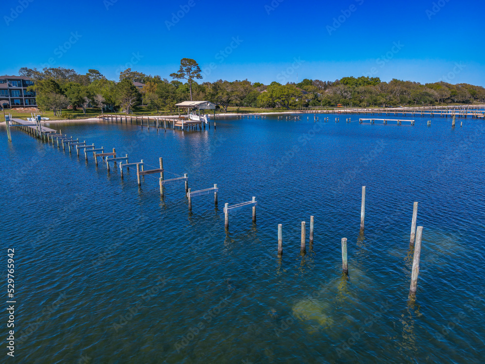 Under construction of a pier at Florida bay with trees at the shore