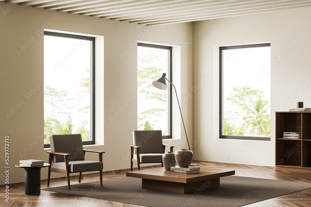 Fototapeta premium Corner view on bright living room interior with armchairs, windows