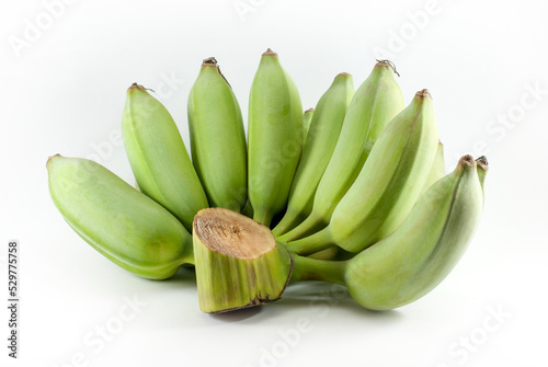 Fresh green bananas on a white background.