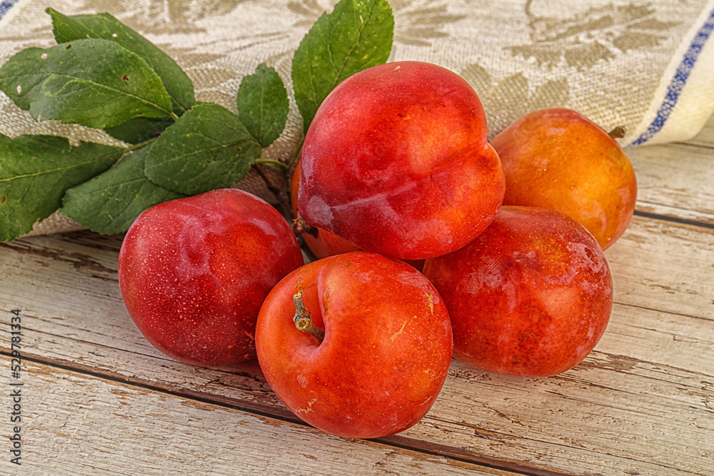Red juicy raw plum heap Red juicy raw plum heap