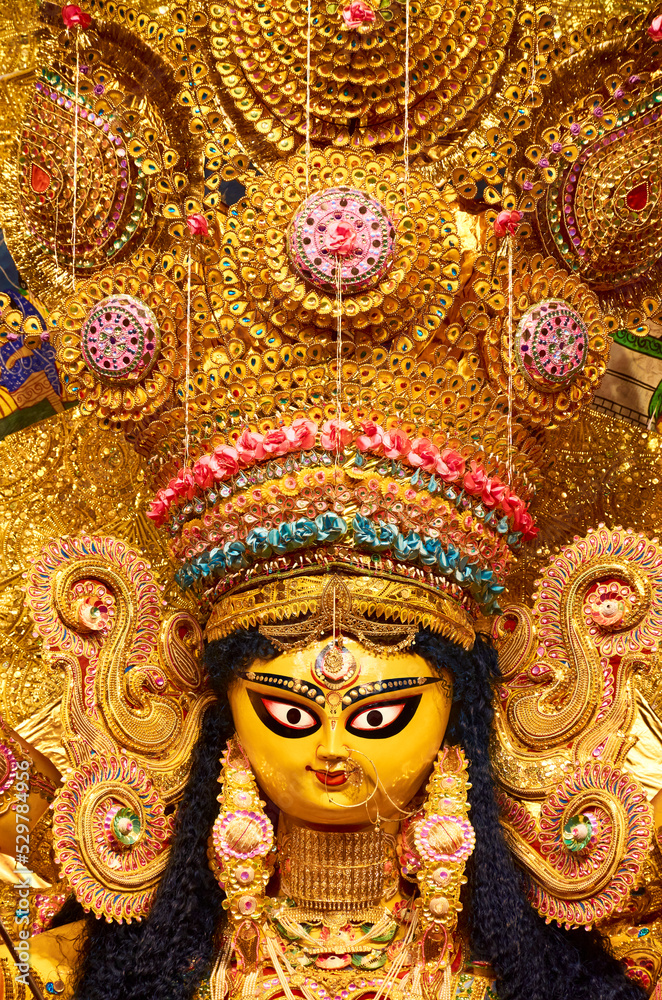 Closeup of Hindu Goddess Durga inside a pandal (temporary resting place for idol) during Durga puja festival in Kolkata. In 2021 It has been declared UNESCO's Intangible Cultural Heritage of Humanity.