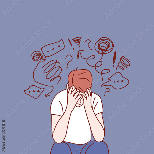 Young sad man sitting and unhappy. Hand drawn style vector illustrations.