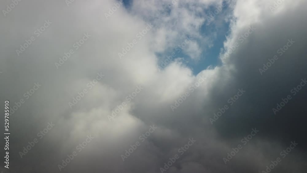 Aerial view. The drone flies over foggy and fluffy clouds. Blue sky sun and sea fog. Abstract aerial nature summer ocean sunset sea and sky background. Vacation, vacation and holiday concept Aerial view. The drone flies over foggy and fluffy clouds. Blue sky sun and sea fog. Abstract aerial nature summer ocean sunset sea and sky background. Vacation, vacation and holiday concept