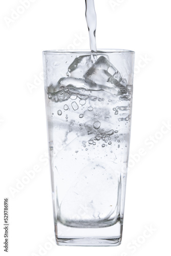 pour water in glass with ice  isolated on white background clipping path
