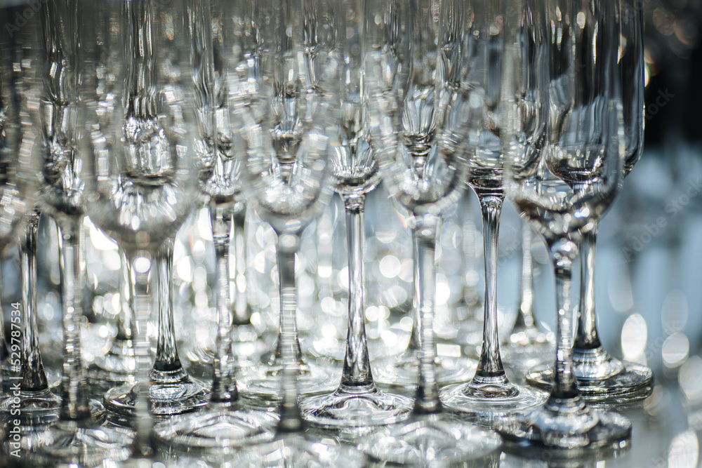 Group of empty and transparent champagne glasses in a restaurant. Group of empty and transparent champagne glasses in a restaurant.