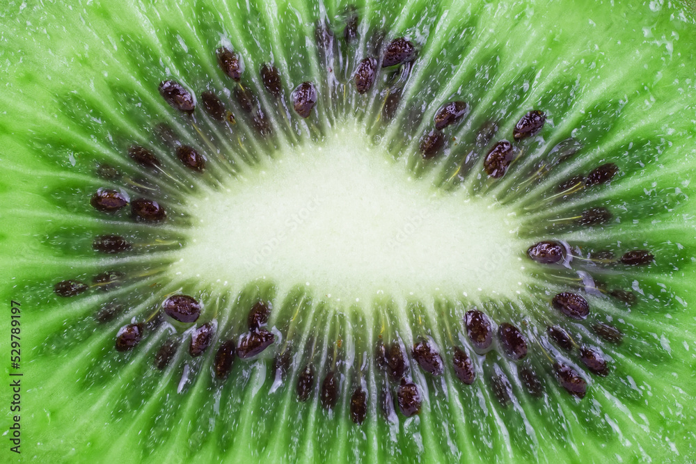Fresh green kiwi macro shot. Fruits background Fresh green kiwi macro shot. Fruits background