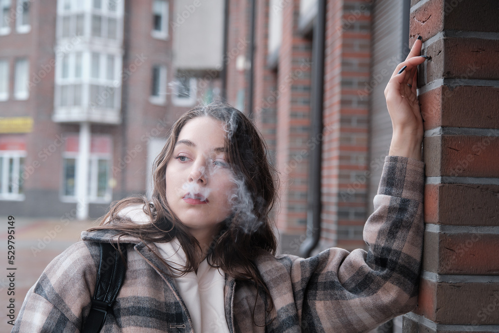 Fototapeta premium young woman smoking