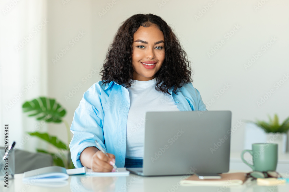 African American Business Lady Using Laptop Taking Notes At Workplace African American Business Lady Using Laptop Taking Notes At Workplace