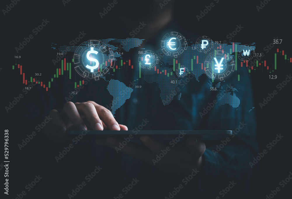 Global currency exchange and money transfer concept, Businessman using tablet with world map and currency sign include dollar yuan yen euro and pound sterling. - obrazy, fototapety, plakaty 