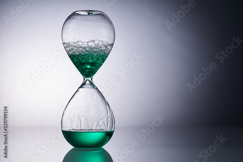 liquid type of hourglass against gray background