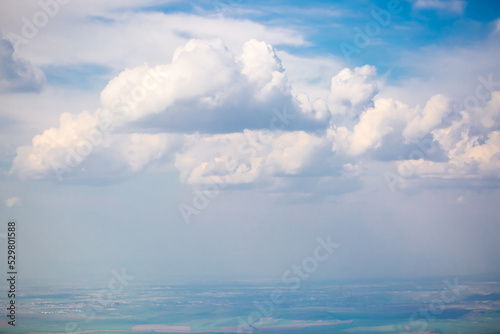 Beautiful clouds against the blue sky. Fluffy clouds, cloudy weather. © Vera