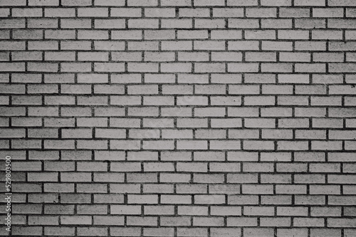 Dark grey brick in traditional pattern with dark grout