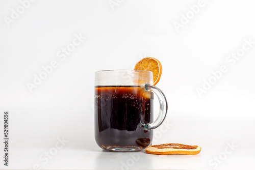 a glass of cola with ice, dried fruit