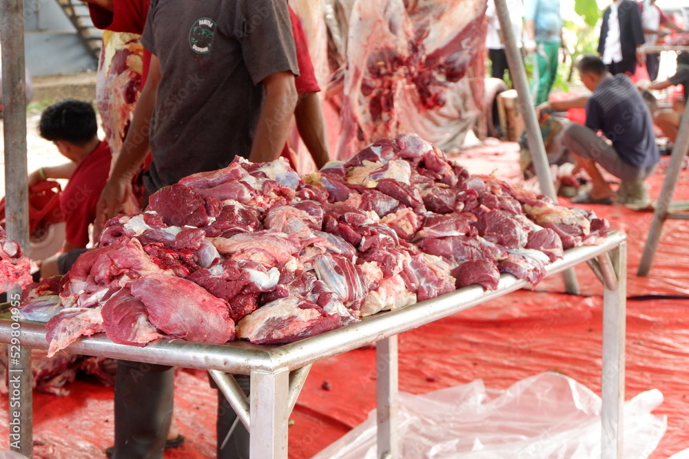 East Jakarta, Indonesia - May 12, 2022: Pieces of meat collected on the table at Idul Adha