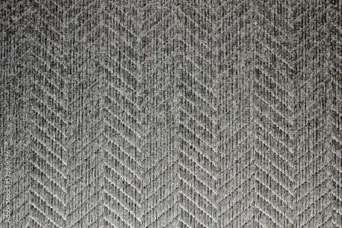 Fabric background. Sticky textured gray fabric with pattern close up. Fabric for the manufacture of fabric blinds or mat, wallpaper
