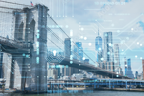 Brooklyn bridge with New York City Manhattan  financial downtown skyline panorama at day time over East River. The concept of cyber security to protect confidential information  padlock hologram