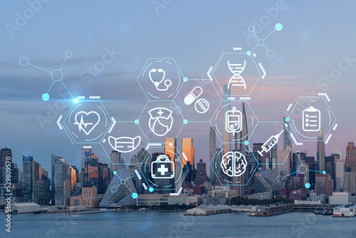 Fototapeta Naklejka Na Ścianę i Meble -  New York City skyline from New Jersey over Hudson River, Midtown Manhattan skyscrapers at sunset, USA. Health care digital medicine hologram. The concept of treatment and disease prevention