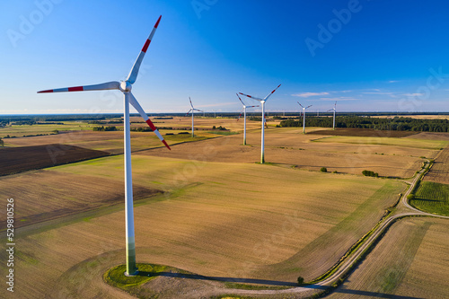A line of wind turbines in Europe. The issue of energy saving in the modern world