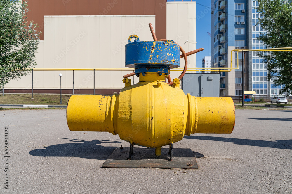 Large yellow gas valve close-up study guide.