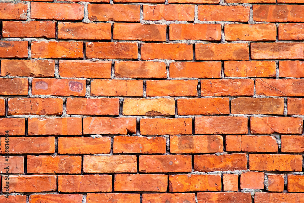 Fototapeta premium Wall of red bricks, texture