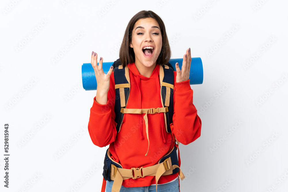 Young caucasian mountaineer girl with a big backpack isolated on white background unhappy and frustrated with something Young caucasian mountaineer girl with a big backpack isolated on white background unhappy and frustrated with something