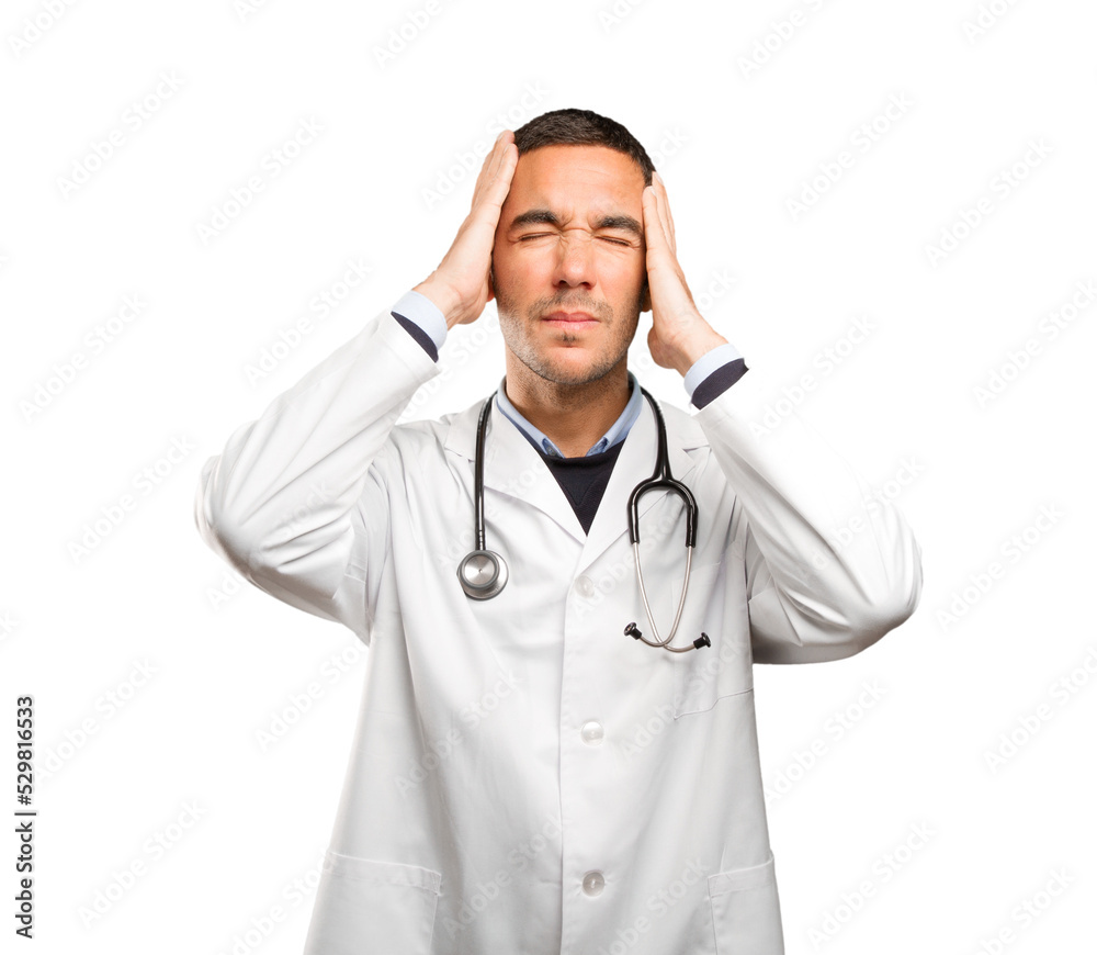 Stressed doctor against white background Stressed doctor against white background