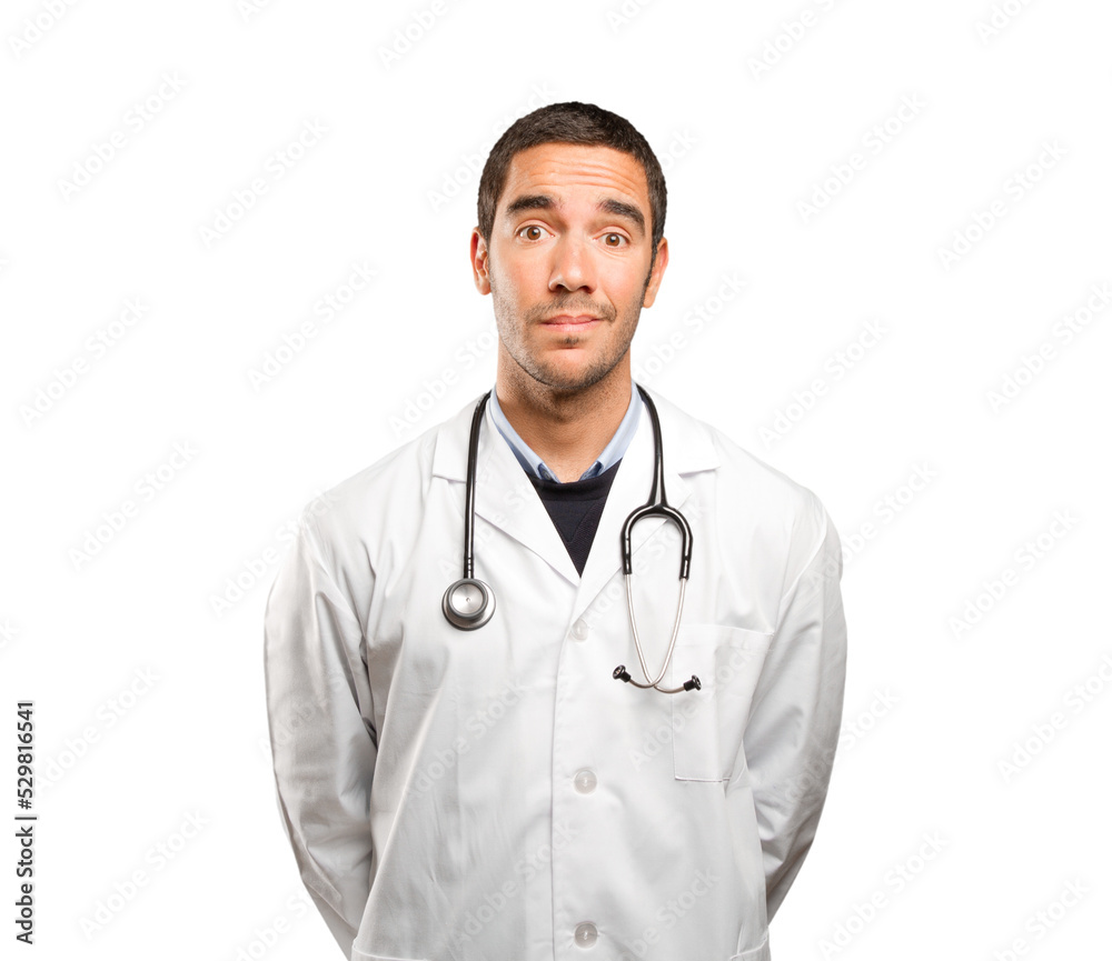 Stressed doctor against white background Stressed doctor against white background