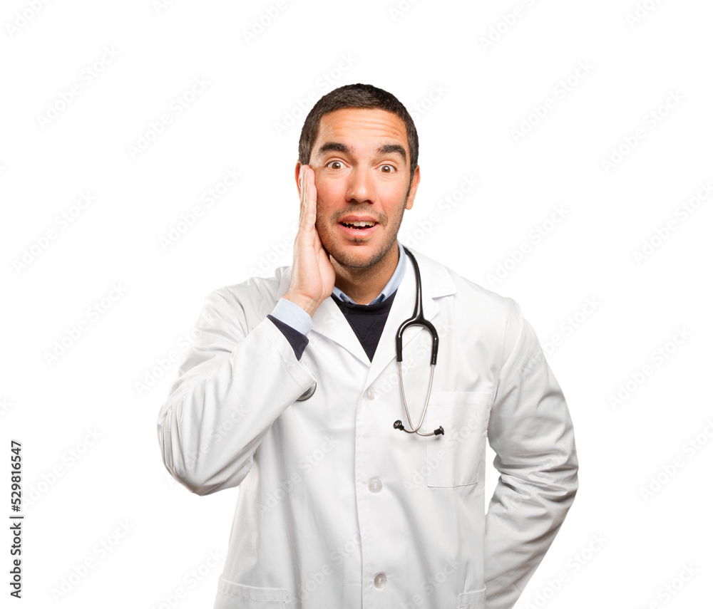 Surprised doctor against white background Surprised doctor against white background