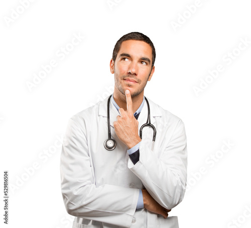 Doubtful doctor against white background