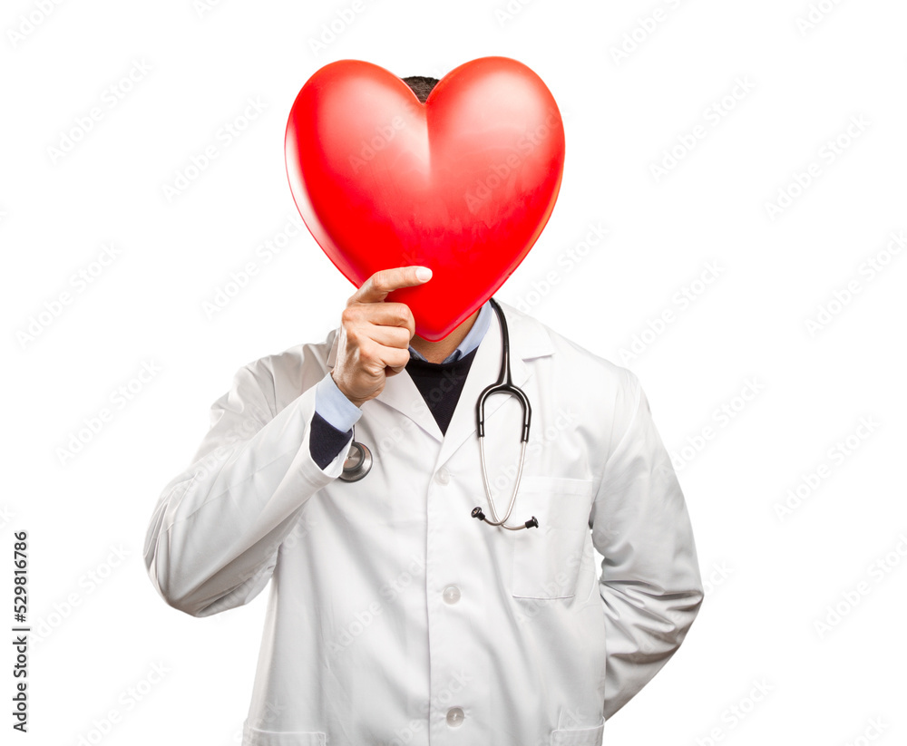 Happy doctor holding a toy heart against white background Happy doctor holding a toy heart against white background