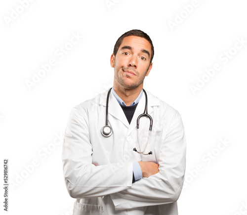 Depressed doctor against white background