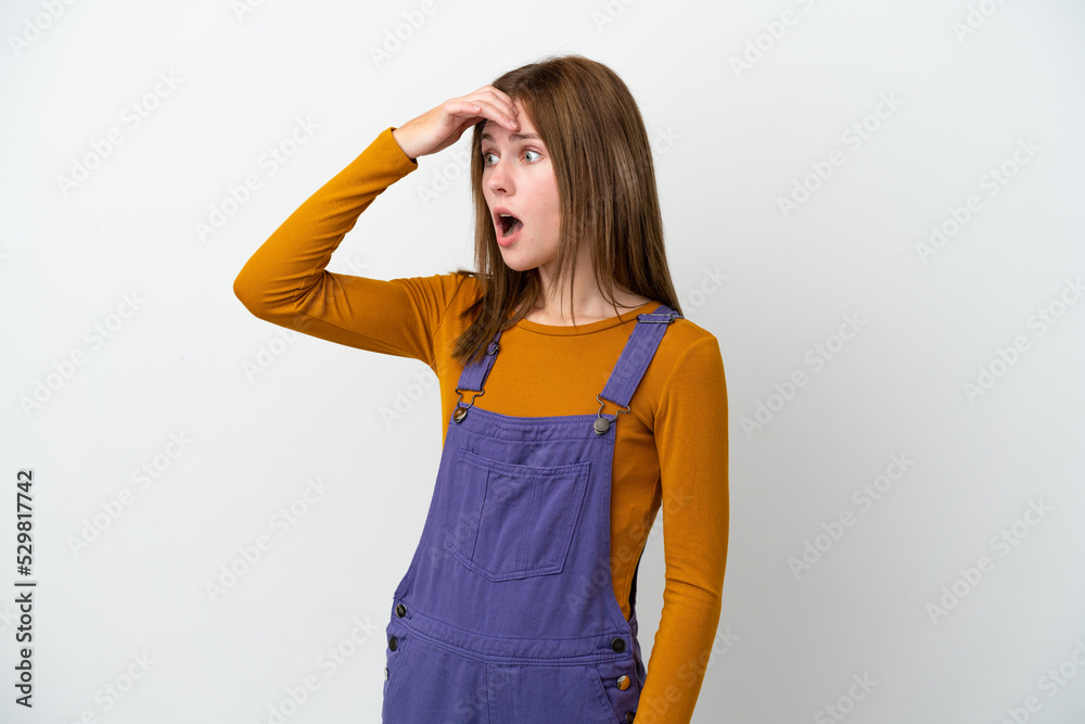 Young English woman isolated on white background doing surprise gesture while looking to the side Young English woman isolated on white background doing surprise gesture while looking to the side