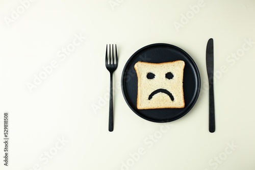 diet celiac gluten free intolerance.  sad bread on the plate. Gluten free food.
