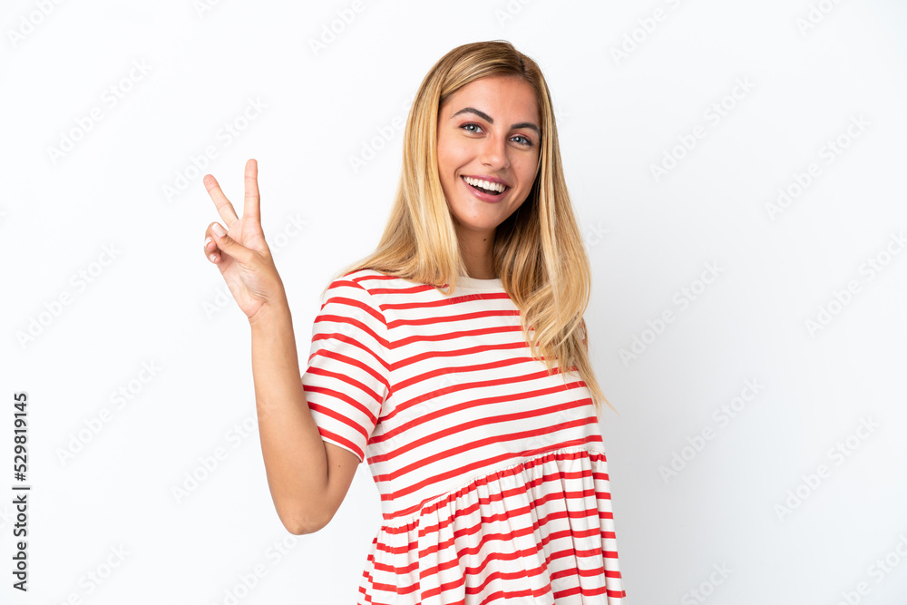 Blonde Uruguayan girl isolated on white background smiling and showing victory sign Blonde Uruguayan girl isolated on white background smiling and showing victory sign