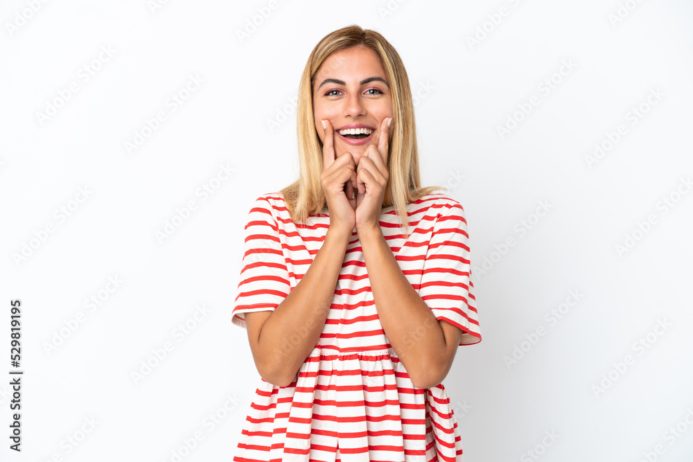 Blonde Uruguayan girl isolated on white background smiling with a happy and pleasant expression