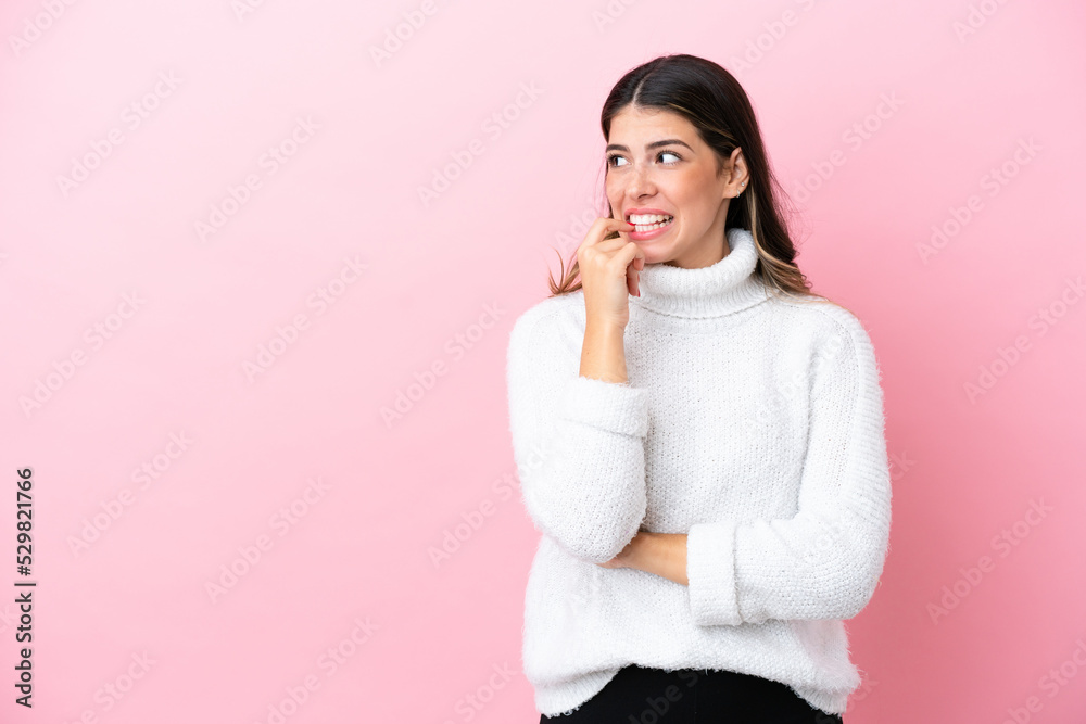 Young Italian woman isolated on pink background nervous and scared Young Italian woman isolated on pink background nervous and scared