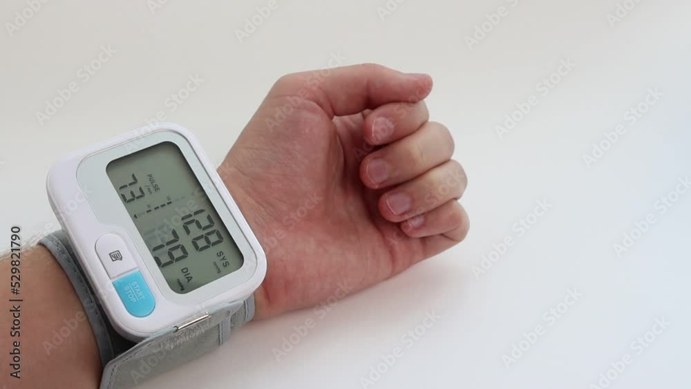 Measuring the pressure on the hand with a portable device. POV. Measuring the pressure on the hand with a portable device. POV.