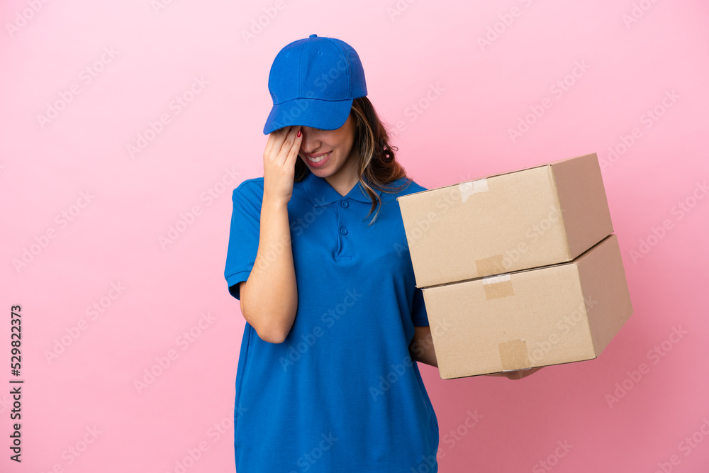 Delivery Italian woman isolated on pink background laughing Delivery Italian woman isolated on pink background laughing