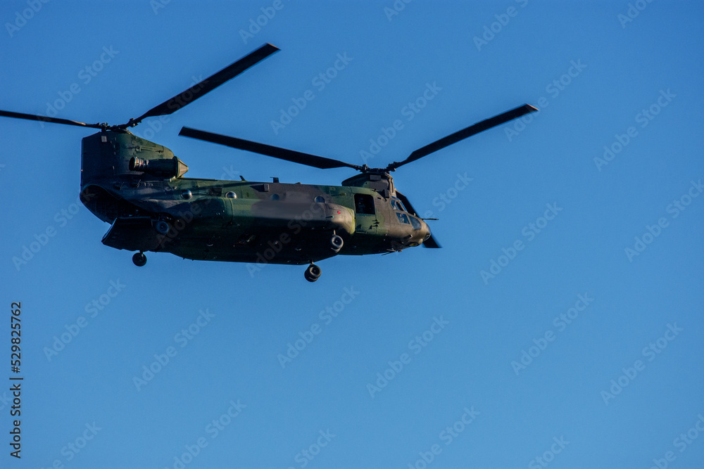 Military helicopter in flight Military helicopter in flight