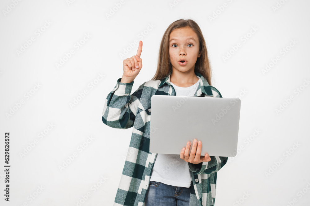Naklejka premium Intelligent caucasian young preteen teenage girl schoolgirl using laptop for social media, online e-learning e-commerce having idea isolated in white background