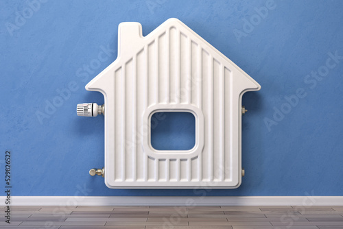 Home heating radiator in the form of house. photo