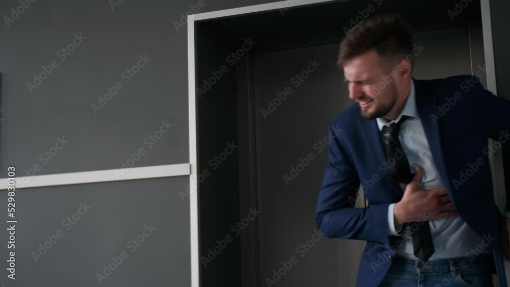 Man having heart attack next to elevator Man having heart attack next to elevator