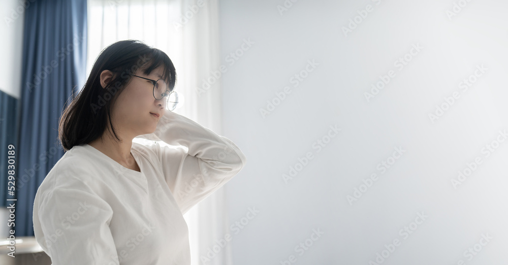 Glasses Young Asian Woman raises her hand up to ear with Happy and Relaxation feel on light white blue background. Glasses Young Asian Woman raises her hand up to ear with Happy and Relaxation feel on light white blue background.